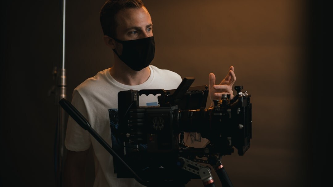 TV presenter standing in front of camera in studio